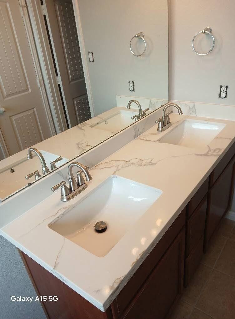 New bathroom vanity with stone top and faucet