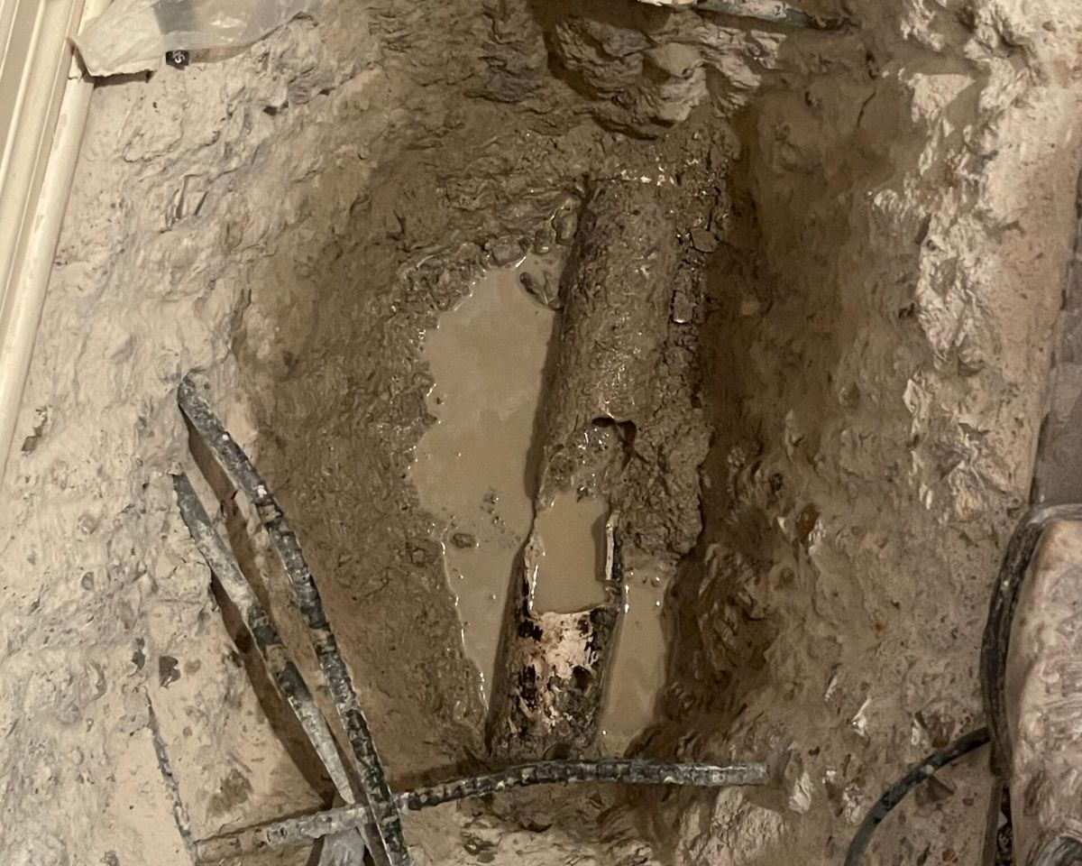 Excavated sewer pipe and fittings in the ground